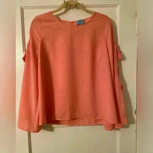 Cece beautiful peach blouse.  This blouse has bell sleeves with tie closures.